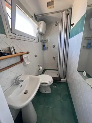 a bathroom with a sink and a toilet at Appartamento con ampio Terrazzo in Rome