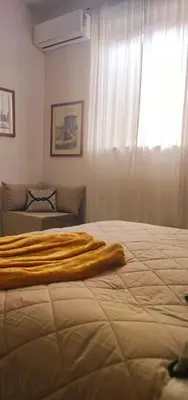a bed with a blanket on it in a bedroom at Vintage House in Rome