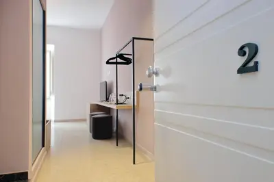 a door leading into a room with a desk at Youroom Quattro Fontane Appartamento in Rome