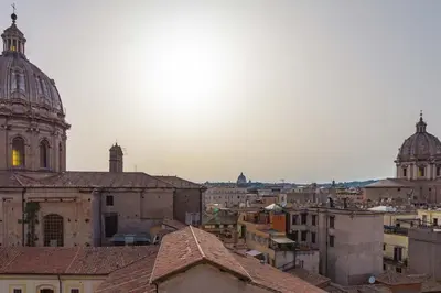 a view of a city with buildings and a cathedral at BrandNew House on the Terrace in Rome