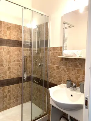 a bathroom with a shower and a sink at NASONI DI ROMA (VICINISSIMO BASILICA SAN GIOVANNI IN LATERANO) in Rome