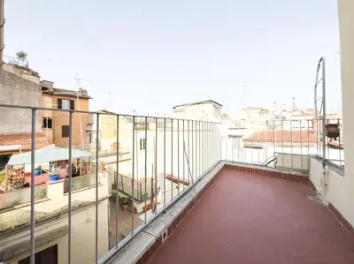 a balcony with a view of a city at Casa Triunfo Boutique Apartment in Rome