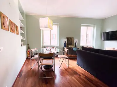 a living room with a glass table and a couch at Casa Triunfo Boutique Apartment in Rome