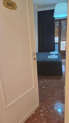 a door leading into a bedroom with a bed at IN ROMA LIFE in Rome