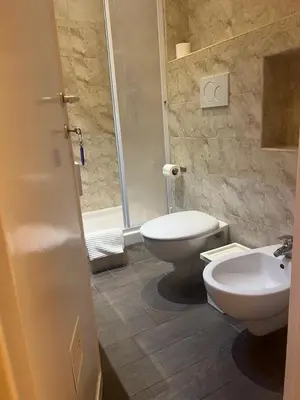 a bathroom with a toilet and a sink at IN ROMA LIFE in Rome