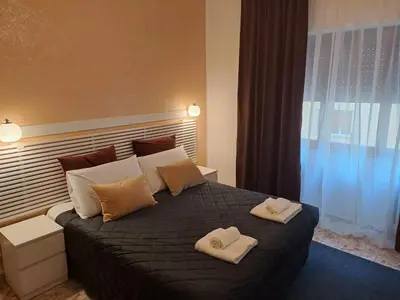 a bedroom with a bed with two towels on it at IN ROMA LIFE in Rome