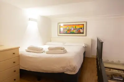 a bedroom with two white pillows on a bed at La dolce Silla - Appartamenti al Vaticano,Via Silla 91 in Rome