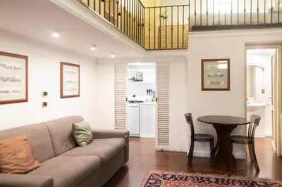 a living room with a couch and a table at La dolce Silla - Appartamenti al Vaticano,Via Silla 91 in Rome