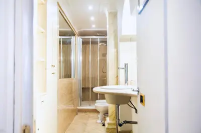 a bathroom with a toilet and a sink at La dolce Silla - Appartamenti al Vaticano,Via Silla 91 in Rome