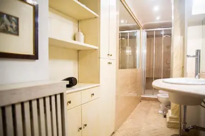 a bathroom with a sink and a toilet at La dolce Silla - Appartamenti al Vaticano,Via Silla 91 in Rome