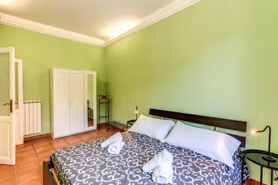 a bedroom with a bed with towels on it at Lovely flat in Testaccio in Rome