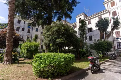 a motorcycle parked in front of a building at Lovely flat in Testaccio in Rome