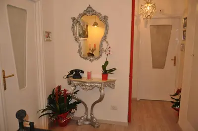 a room with a table and a mirror on the wall at Jet Lag Guesthouse in Rome