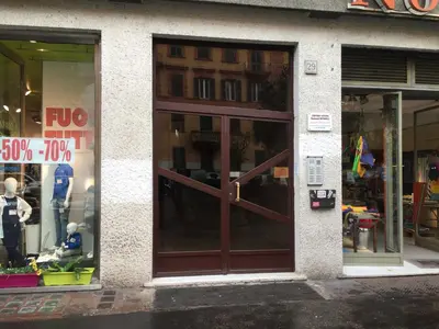 a store front with a large wooden door at Jet Lag Guesthouse in Rome