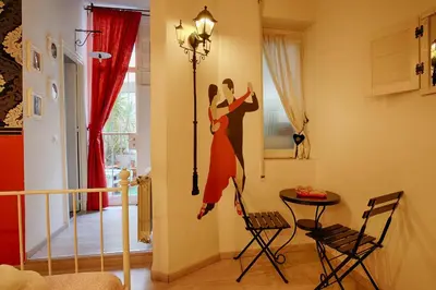 a mural of a couple dancing on a wall at Jet Lag Guesthouse in Rome