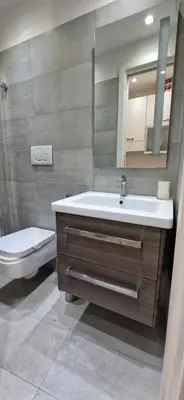 a bathroom with a sink and a toilet at Savelli Apartment Old Town - near Navona Place in Rome