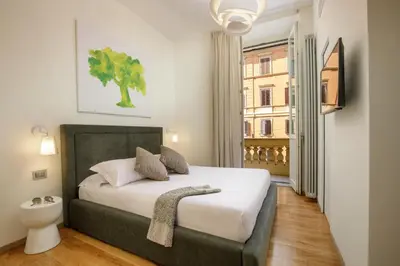 a bedroom with a bed and a window at Porta Castello Charme in Rome