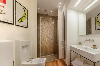 a bathroom with a sink and a shower at Porta Castello Charme in Rome