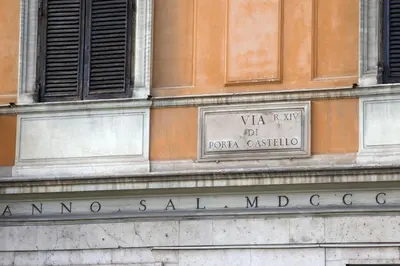 a sign on the side of a building at Porta Castello Charme in Rome