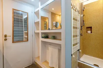 a bathroom with a walk in shower and a sink at Green Window Roma in Rome