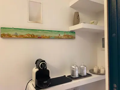 a kitchen with a counter with a coffee maker on it at Karol Apartment Rome in Rome