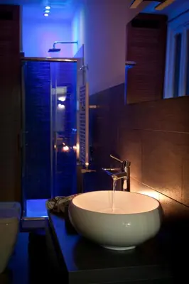 a bathroom with a white sink and a shower at Chroma Italy - Chroma Apt Campo de' Fiori in Rome