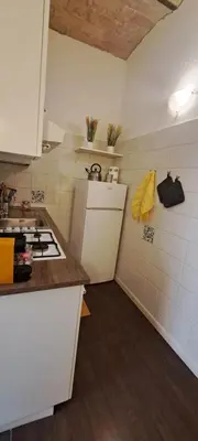 a kitchen with a stove and a counter top at Central Rome Suite in Rome