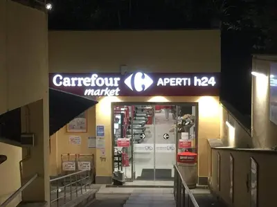 a store entrance with a carleton market sign on the wall at Pochi passi da San Pietro Metro A Cipro in Rome