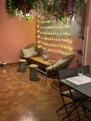 a room with a table and chairs and lights at Blue vatican house Rome in Rome