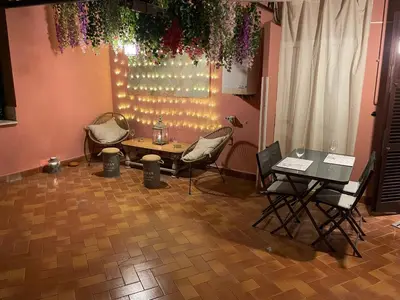 a group of chairs and a table in a room at Blue vatican house Rome in Rome