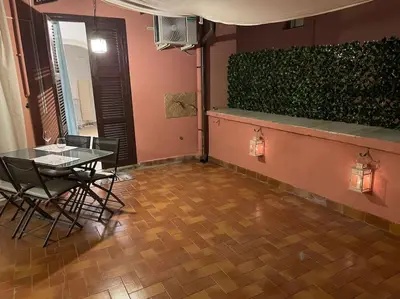 a dining room with a table and chairs in a room at Blue vatican house Rome in Rome
