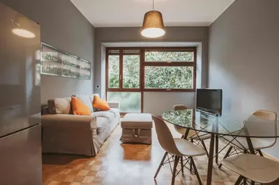 a living room with a couch and a glass table at EasyTopStay - Peaceful Retreat near San Pietro in Rome