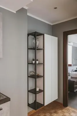 a shelf in the corner of a room at EasyTopStay - Peaceful Retreat near San Pietro in Rome