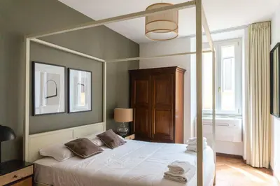 a bedroom with a canopy bed in a room at EasyTopStay - Piazza Navona Charming Apartment in Rome