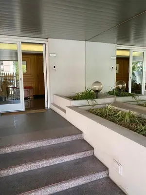 a building with a staircase leading to the entrance at Giulio Cesare Holiday House in Rome
