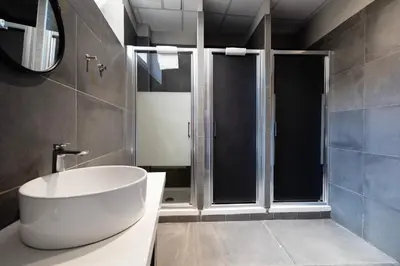 a bathroom with a large white tub and a window at Borgo Ripa Urban Travel in Rome