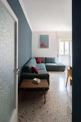 a living room with a couch and a coffee table at Nel cuore di Monteverde in Rome