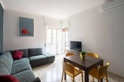 a living room with a couch and a table at Nel cuore di Monteverde in Rome