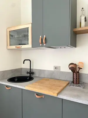 a kitchen with a sink and a counter top at La Dolce Vita - Old Testaccio Luxury Apartment in Rome