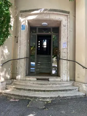 an entrance to a building with a revolving door at La casa dell’Appio in Rome
