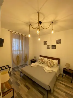 a bedroom with a large bed in a room at La casa dell’Appio in Rome