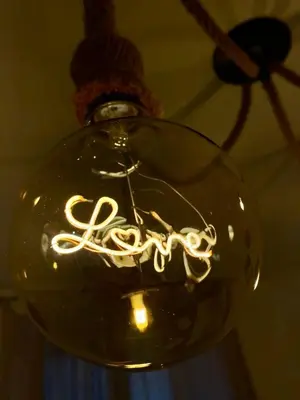 a glass light hanging from a ceiling at La casa dell’Appio in Rome