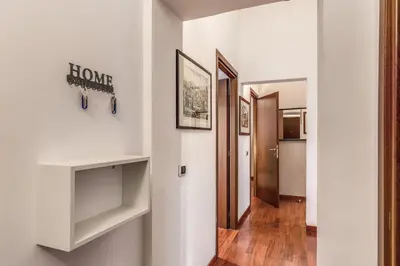 a hallway with white walls and wooden floors at MyRHome - Spanish Steps in Rome