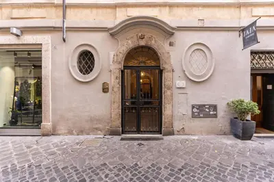 a building with a door on a street at MyRHome - Spanish Steps in Rome