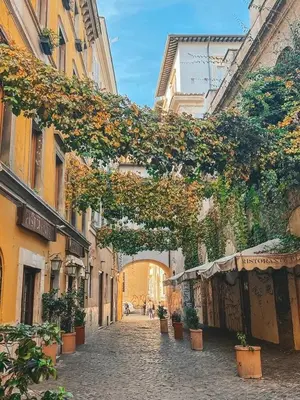 an old car parked on a cobblestone street at Trastevere House-suite elegante nel centro storico in Rome