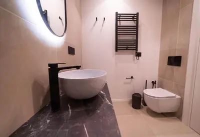 a bathroom with a large tub and a toilet at Scipioni Luxury Suite in Rome
