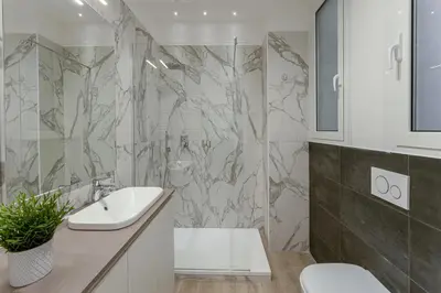a bathroom with a sink and a shower at Vatican Suite Apartament Roma in Rome