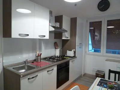 a small kitchen with a sink and a stove at Stesi Vacanze in Rome