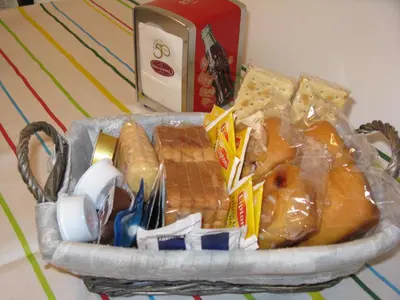 a basket full of food on a table at Stesi Vacanze in Rome