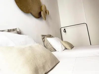 a bedroom with two beds and a mirror on the wall at Germanico Apartments in Rome